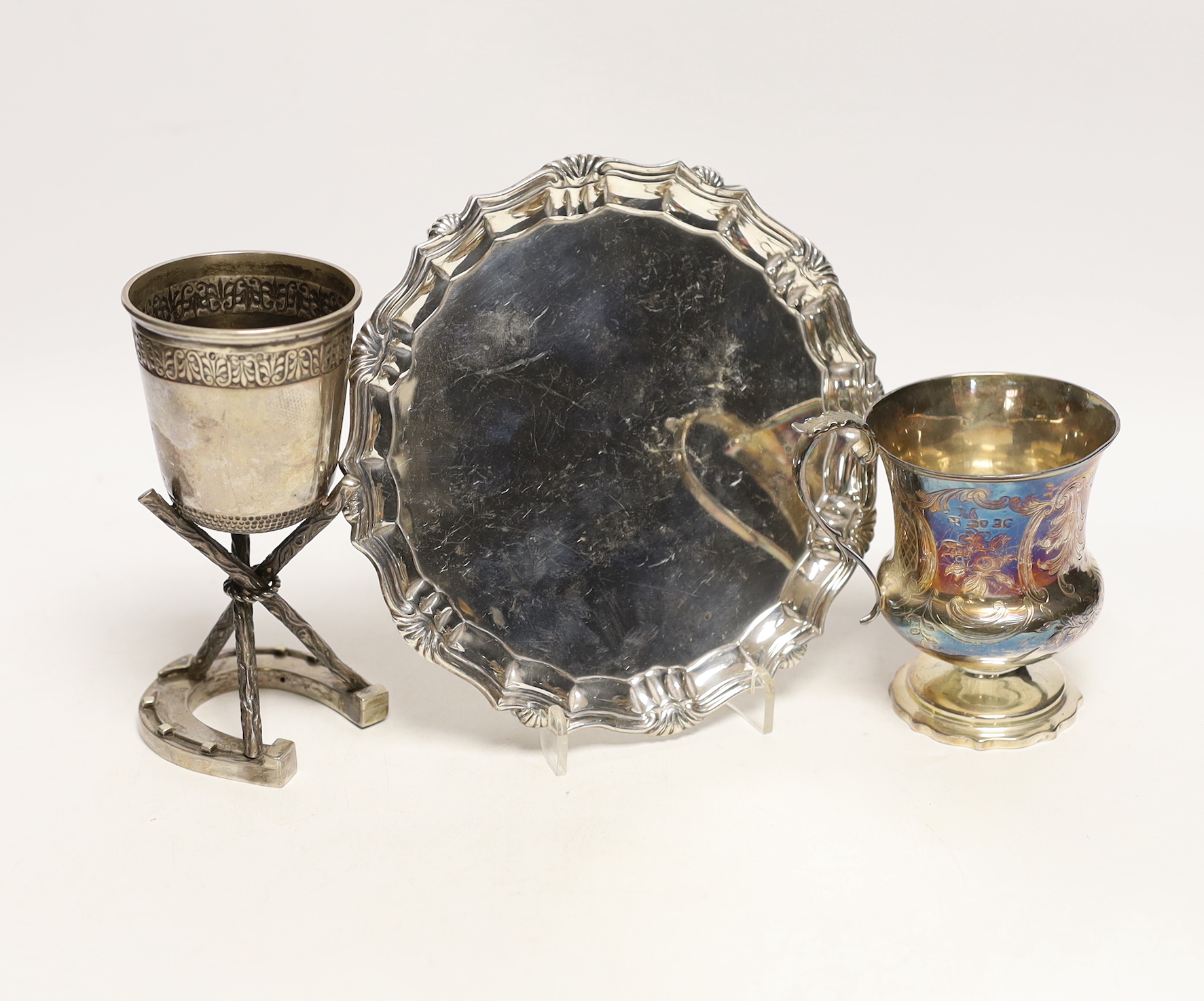 A late Victorian silver waiter, Charles Stuart Harris, London, 1887, 17cm, together with a Victorian silver christening mug, London, 1873 and a similar Scottish silver cup with rustic supports, Edinburgh 1876, on a horse